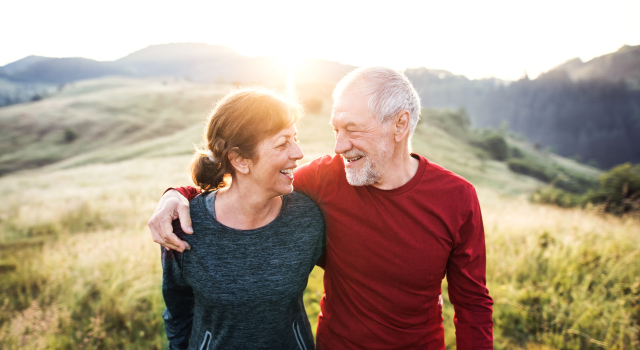 image of couple walking in the sun
